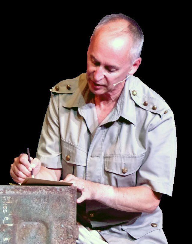 An actor as Captain Race writing a letter