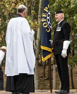 The padre and the COFEPOW standard bearer in the Grove
